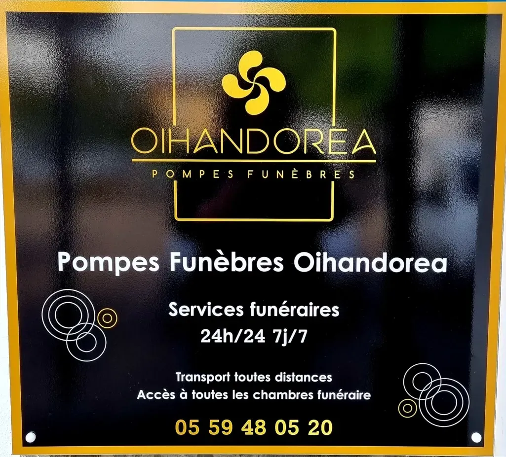 Plaque signalétique de l'agence Pompes Funèbres Oihandorea indiquant les services 24h/24 et 7j/7.